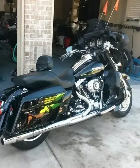 Black Harley-Davidson touring motorcycle with polished chrome after detailing